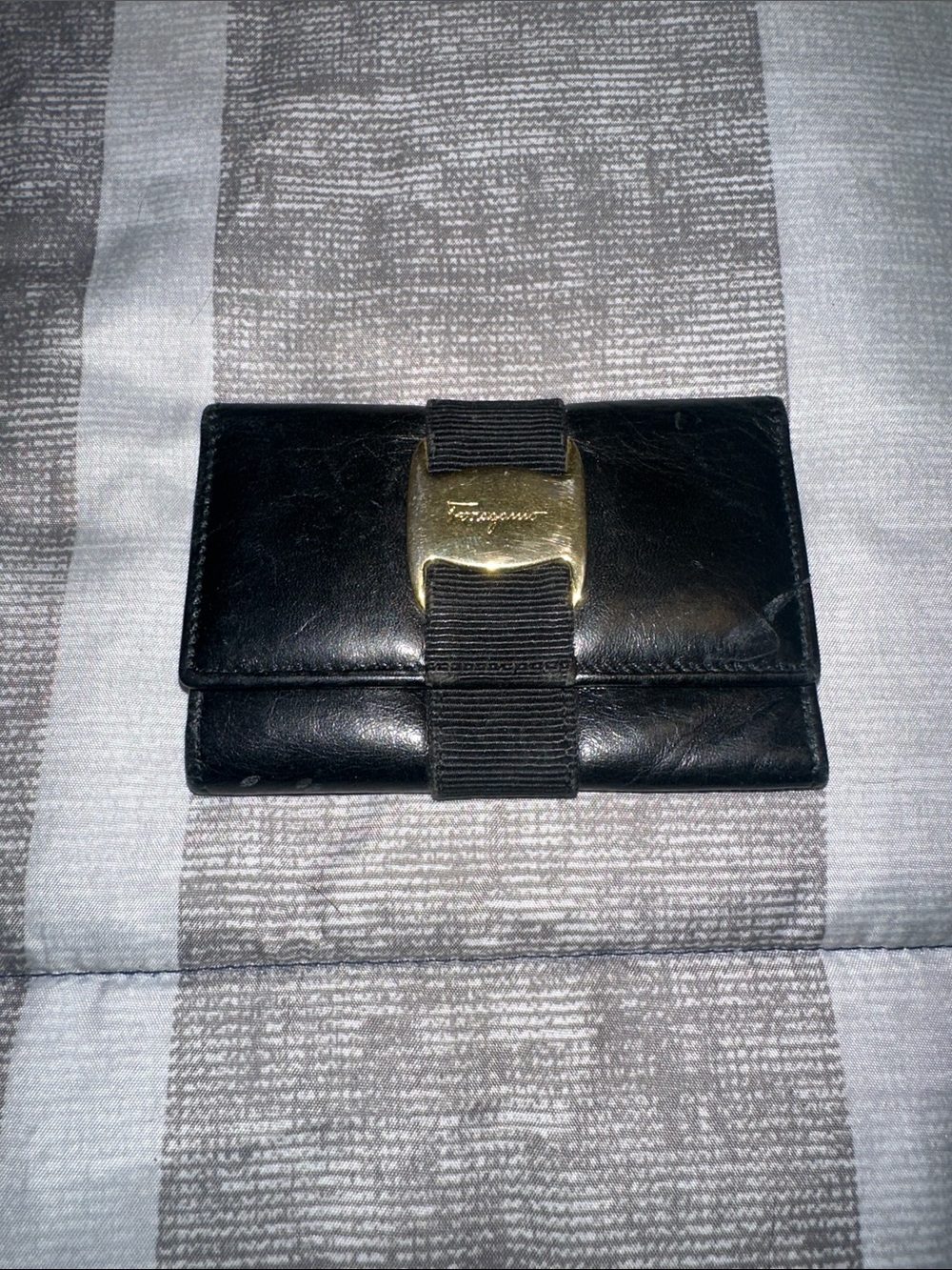 Salvatore Ferragamo Black Leather Wallet with Gold Buckle and Grosgrain